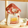 A wooden mushroom castle stacking toy puzzle with round wooden pieces in orange and beige colors.