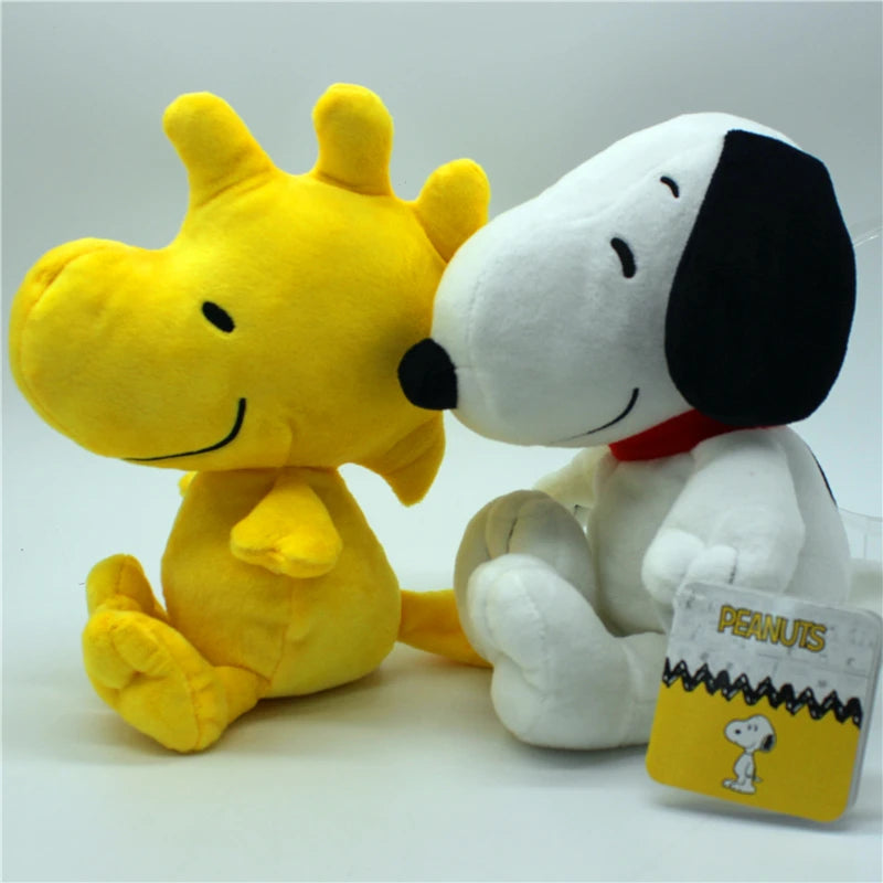 A yellow and white plush set featuring Snoopy and Woodstock characters.