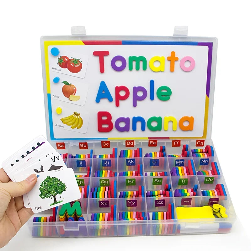 A magnetic alphabet spelling kit featuring fruit names like Tomato, Apple, Banana, and various letters.