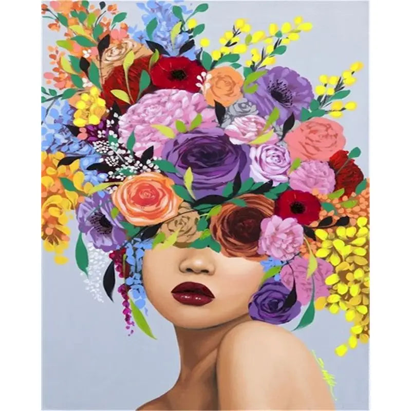 A woman's face is adorned with a vibrant, colorful floral painting, featuring various shades of red, purple, pink, and yellow