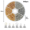 A circular organizer case filled with various sizes of gold and silver wire jewelry findings for crafting