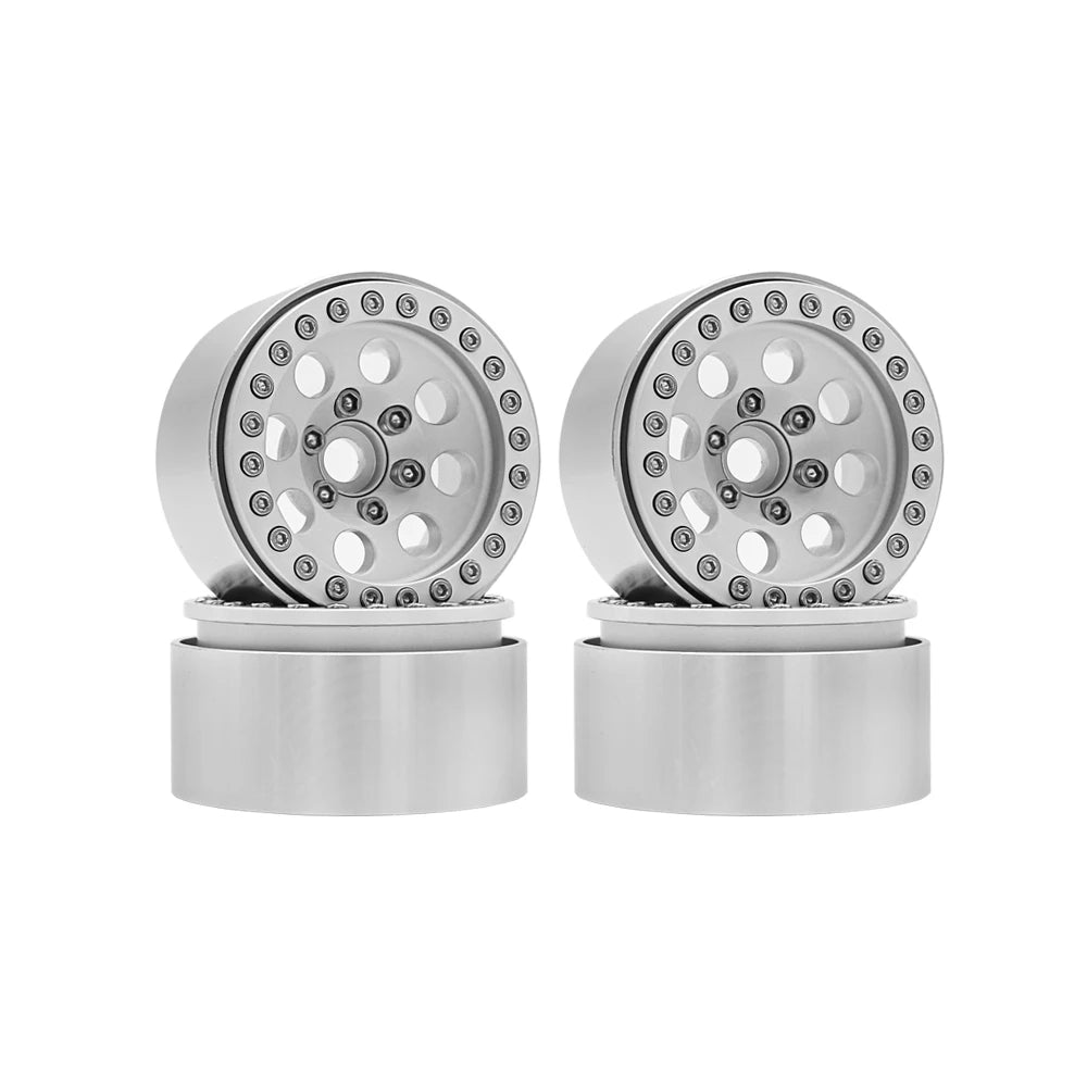 A pair of 1/10 RC crawler metal beadlock wheels with removable hex hubs shown on a white background.