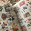 A close-up of a retro botanical sticker book featuring floral illustrations and vintage designs.