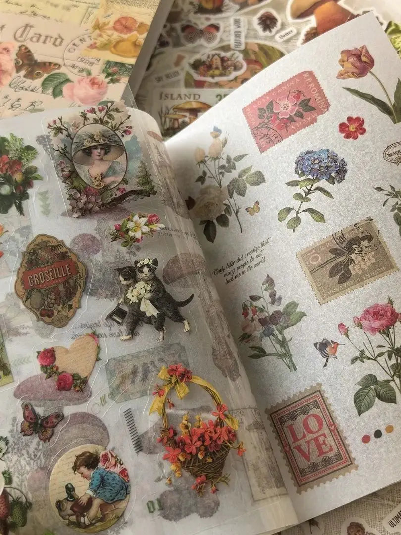 A close-up of a retro botanical sticker book featuring floral illustrations and vintage designs.