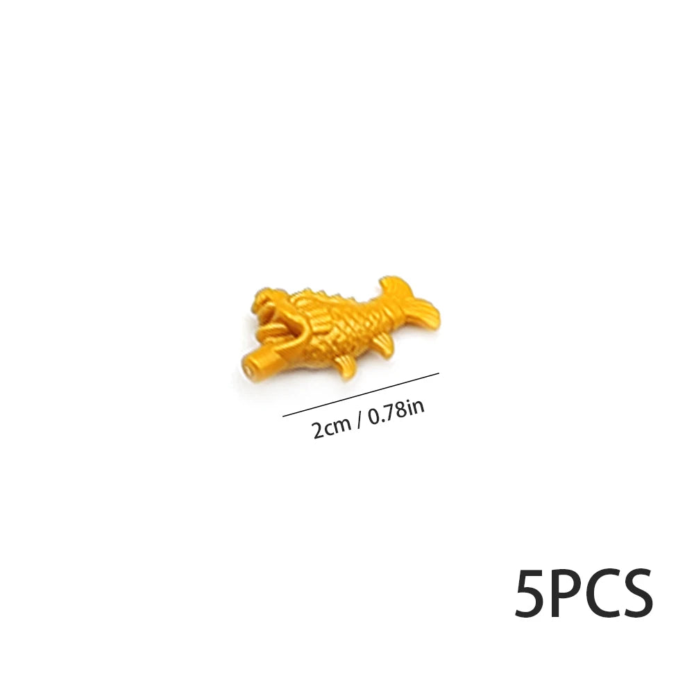 Five yellow plastic marine creature building blocks.