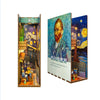 A DIY book nook kit featuring a detailed miniature scene with LED lighting and a dust cover.