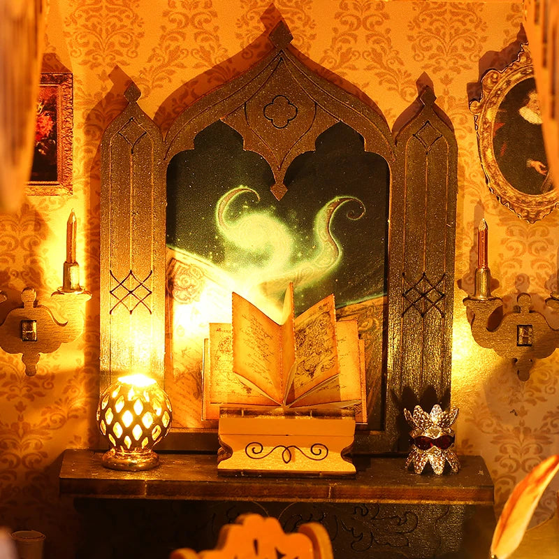 A DIY book nook kit featuring miniature furniture and an ornate, glowing diorama display.