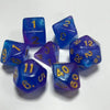A set of seven blue and purple polyhedral acrylic dice showing numbers 1 through 12 and a 40