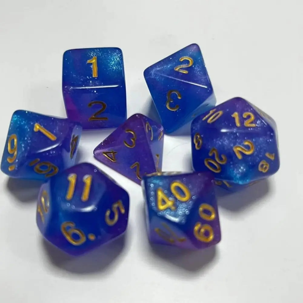 A set of seven blue and purple polyhedral acrylic dice showing numbers 1 through 12 and a 40