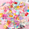 Assorted colorful candy resin flatbacks and candies for DIY crafts and jewelry making