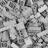 A close-up view of a bulk set of gray building blocks for creative DIY projects.
