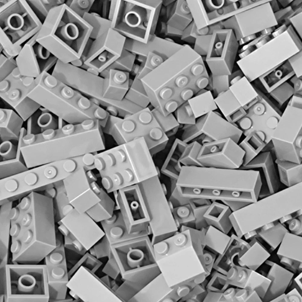 A close-up view of a bulk set of gray building blocks for creative DIY projects.