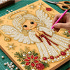A detailed craft kit showing a gold and pearl-themed angel design on a canvas, surrounded by beads and tools.