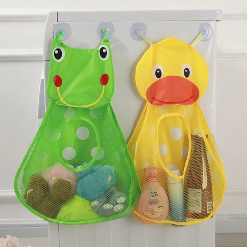 A yellow duck toy storage bag with a green frog toy, featuring suction cups for bathroom use.