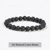 A bracelet made of dark, textured lava stone beads.