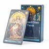 A box of the Stained Glass Tarot Card Deck featuring an illustration of a woman within a glowing stained glass window.
