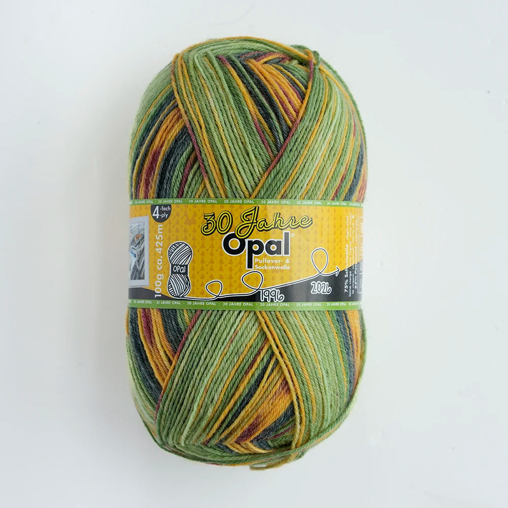 A ball of Opal 4-ply sock yarn in a multicolored blend of green, yellow, and gold threads.
