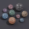 A collection of round loose spacer beads in various colors and glitter finishes, including pink, purple, blue, green, and gol