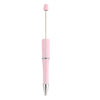 A pink beadable ballpoint pen with a silver tip and a pink cap.