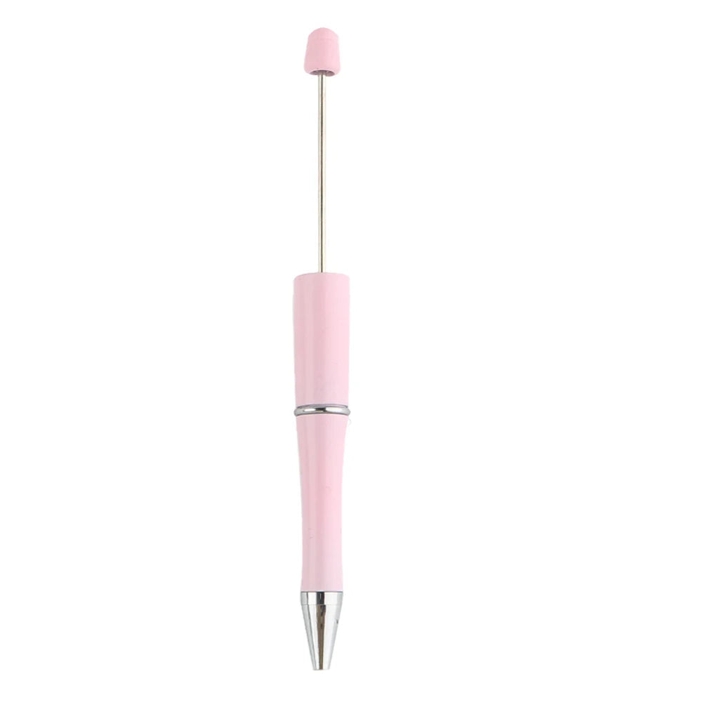 A pink beadable ballpoint pen with a silver tip and a pink cap.