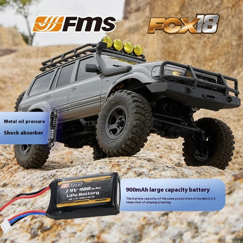 A black 1:18 scale remote control off-road climbing car with an aftermarket front bumper and a LiPo battery visible.