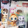 A clear plastic package containing three mini posable animal figures, including a lion, a cat, and another small animal.