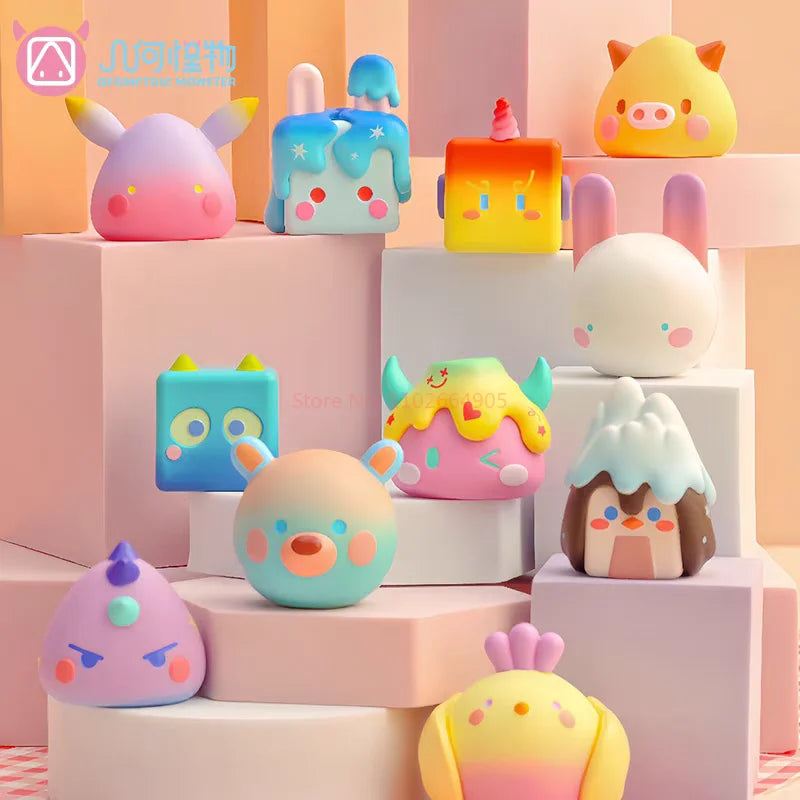 A collection of colorful geometric monster mini bean blind box vinyl figures displayed on pink and white tiered boxes.