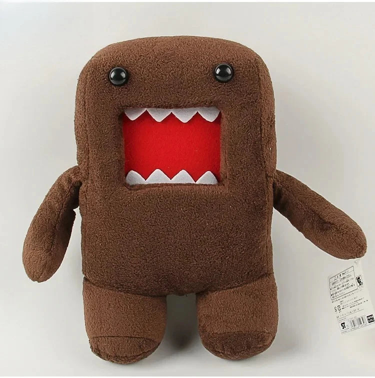A brown plush toy shaped like a bear with a red mouth showing white teeth.