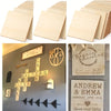 A set of ten unfinished wood squares used for crafting, featuring a cross design and save the date text.