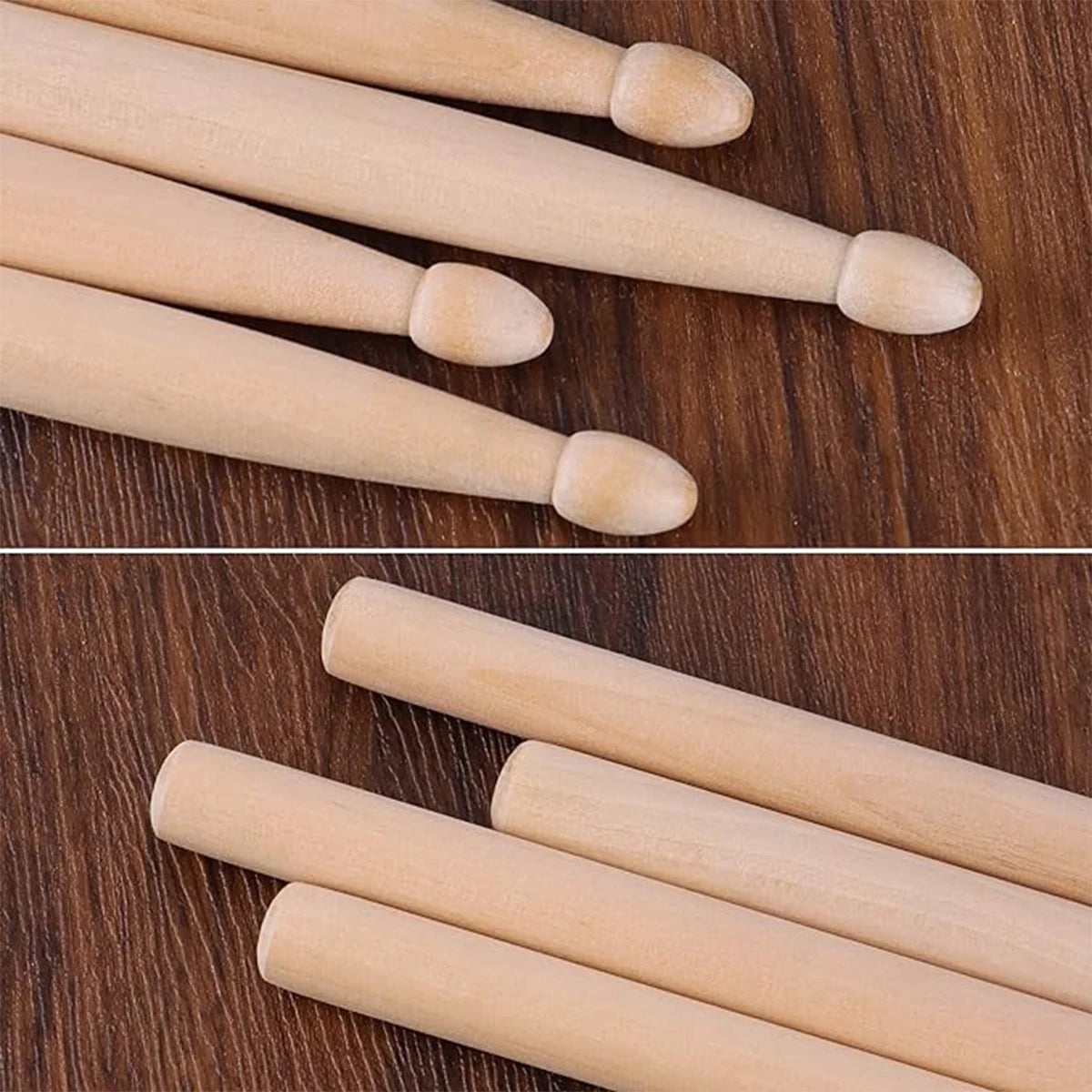 A set of light wood maple drumsticks arranged diagonally on a dark wooden surface.