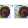 A ball of hand-dyed rainbow merino wool yarn showing various color transitions.