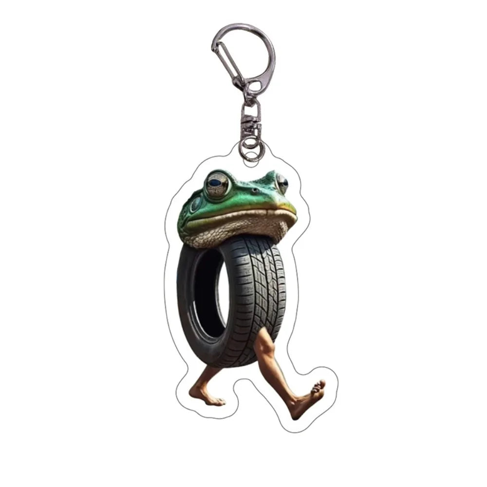 Acrylic keychain featuring a frog design with a tire tread and a hand grip.