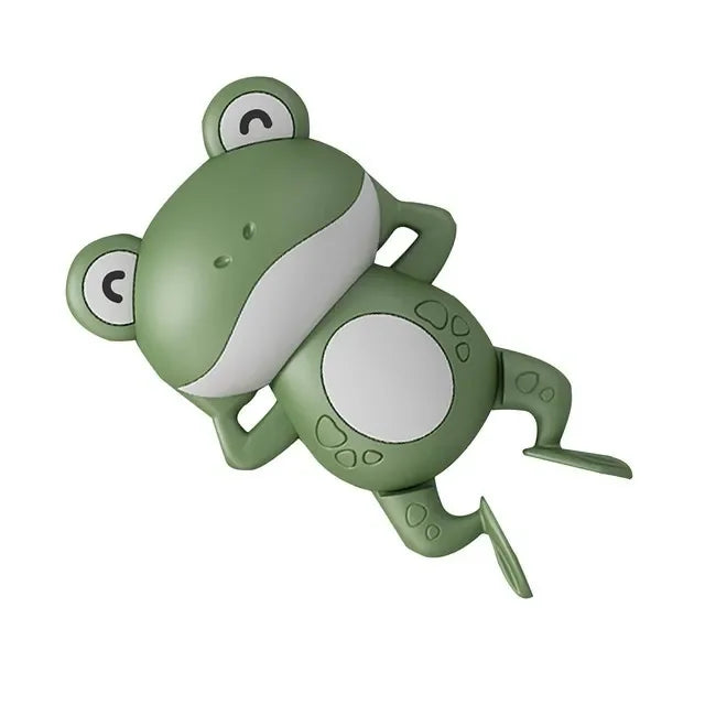 A green wind-up swimming turtle bath toy with white markings.