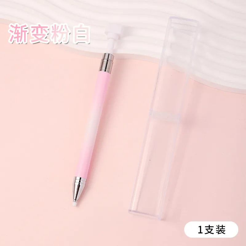 A pink gradient rotating dotting pen is shown next to its clear storage case.