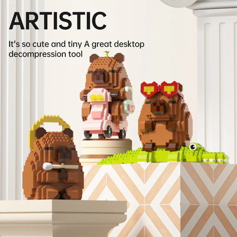 A set of brown and pink capybara building blocks, including a bear and a frog, displayed on a white pedestal.