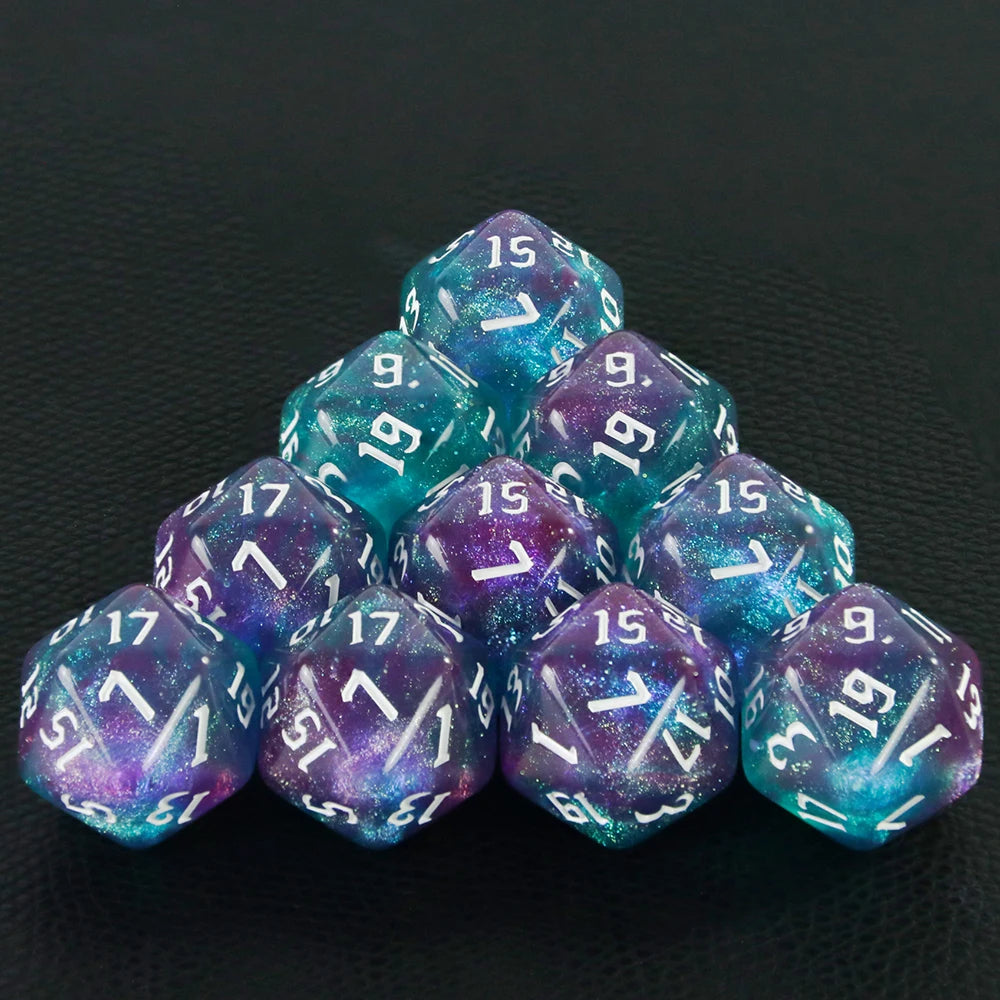 A pyramid of ten glitter D20 dice in various shades of blue and purple resting on a dark surface.