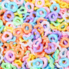 A close-up of colorful, wave-patterned acrylic beads in various pastel shades like pink, yellow, blue, and purple.