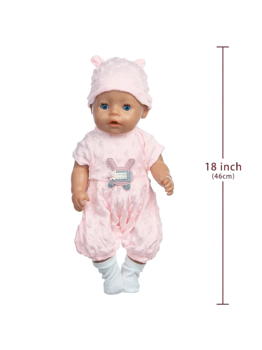 A pink baby doll wearing a matching outfit with a cat print shirt and a pink hat.