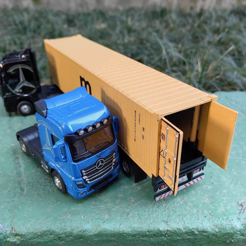 A blue Mercedes-Benz truck is shown next to an open, empty cardboard container box.