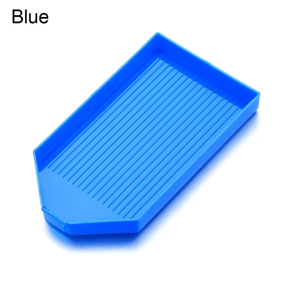 A bright blue diamond painting tray with a pop-up plug for bead sorting.
