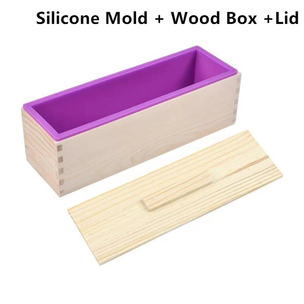 A purple silicone mold for soap is shown inside a light wood box with a lid and a wooden cutting knife.