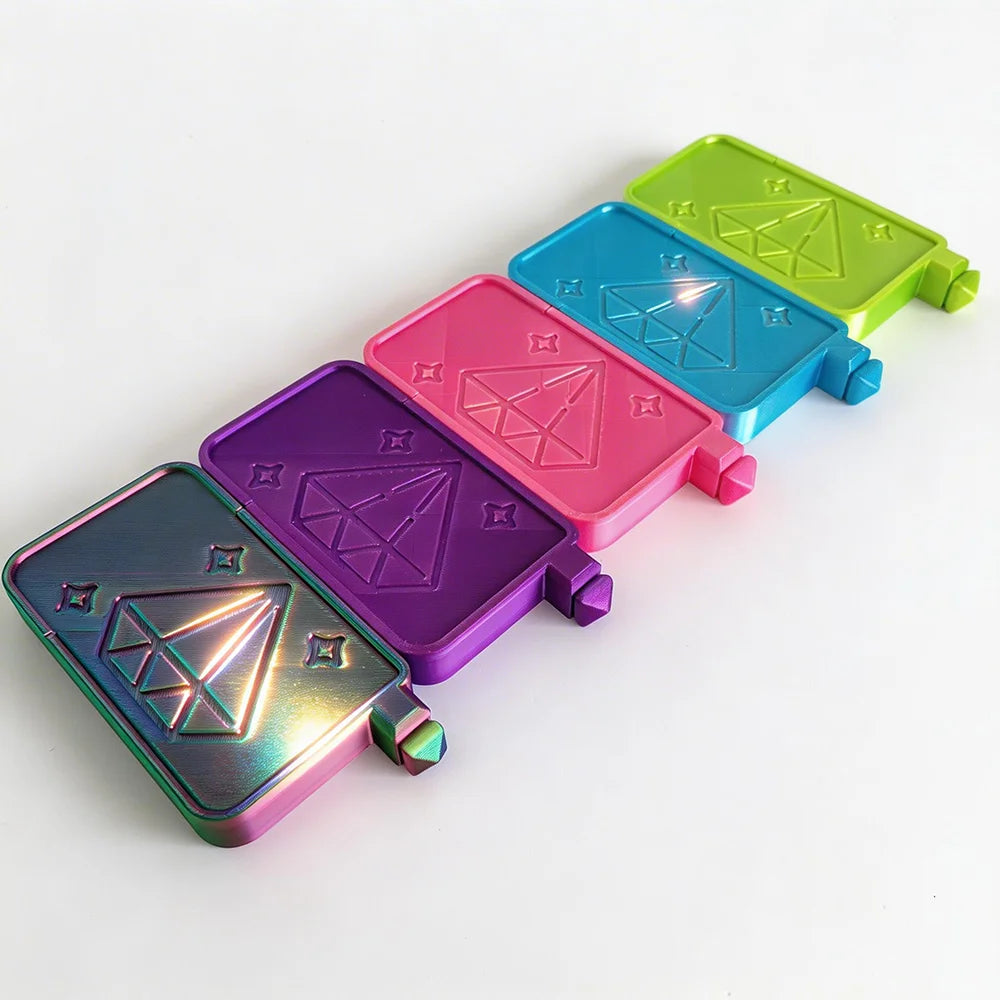 A set of five iridescent diamond painting trays in various colors, including green, blue, pink, purple, and magenta.