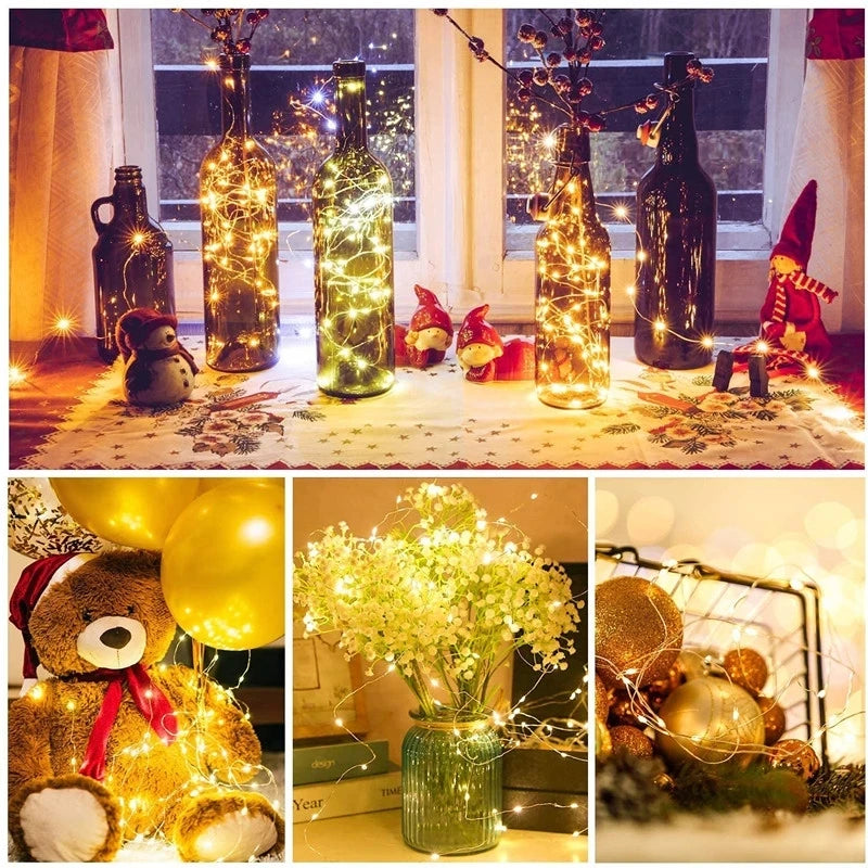 A collection of battery-powered fairy lights illuminating various decorative items and plants.
