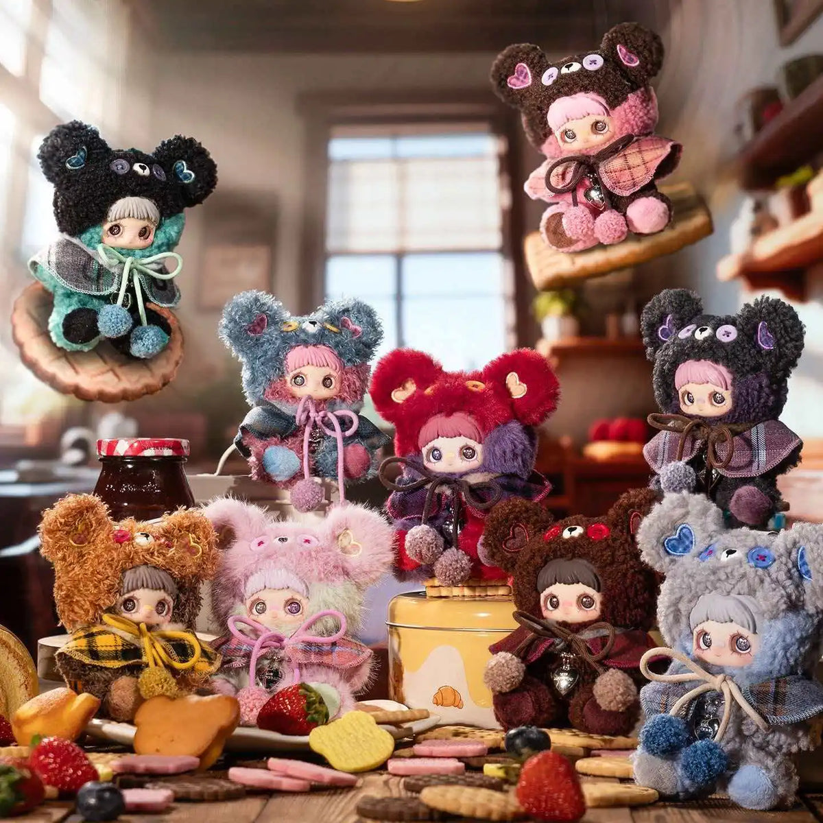 A collection of tiny bear plush charms and figurines in various colors and textures displayed on a wooden surface.