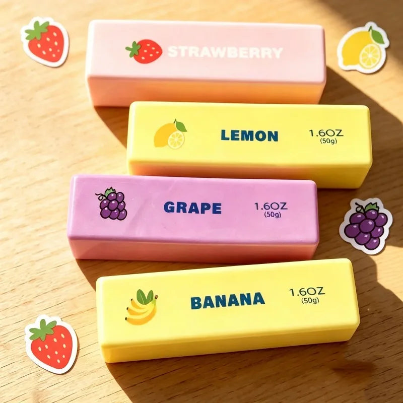 Five squishy fidget toys in pink, yellow, and purple colors featuring strawberry, lemon, grape, and banana designs.