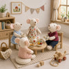 A collection of handmade mouse plush dolls dressed in various retro outfits sitting on a light rug.