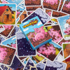 A collection of card game tiles featuring pink pigs and various backgrounds for a party game