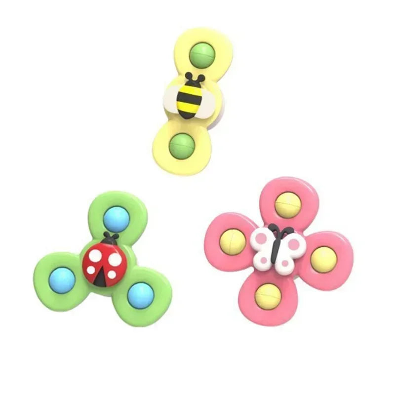 A set of three colorful baby bath toys featuring suction cup spinners shaped like an insect and a flower.