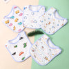 A set of three white cotton baby bibs with various colorful embroidered patterns and adjustable closures arranged on a light 