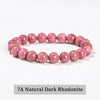 A bracelet made of 7A Natural Dark Rhodonite beads in a pink color.